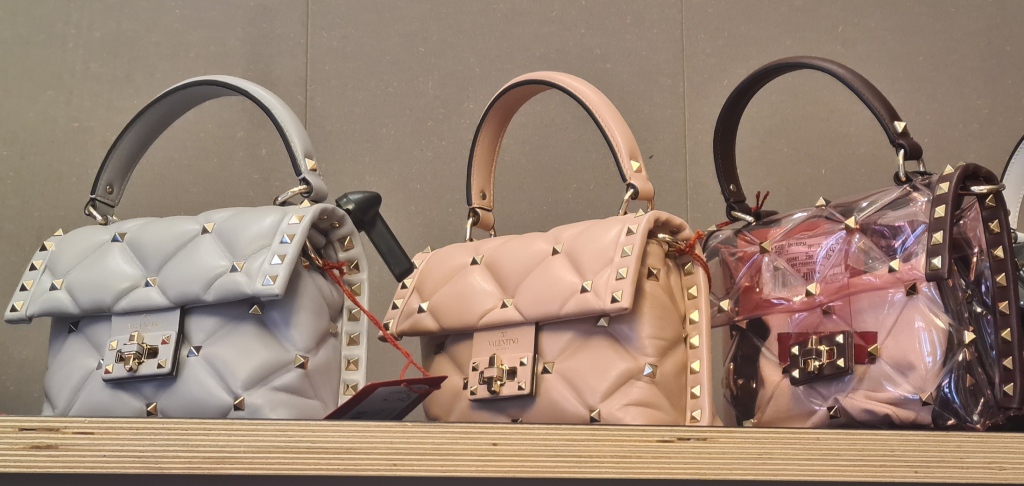 Discount designer bags for AW'20 including studded and quilted top handle bags from Valentino